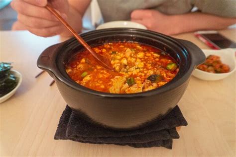 soondubu-jjigae-korean-tofu-stew-chopsticks-and image