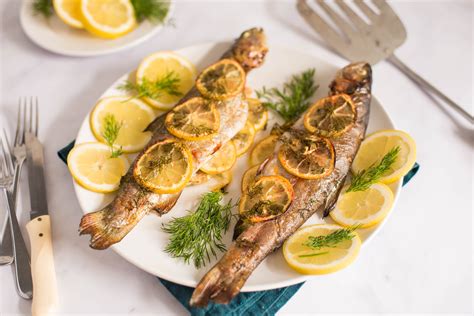 baked-whole-trout-recipe-with-lemon-and-dill-the-spruce-eats image