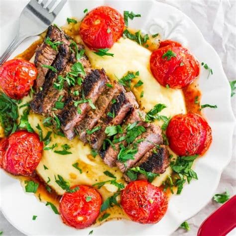 creamy-polenta-with-grilled-steak-and-roasted-tomatoes image