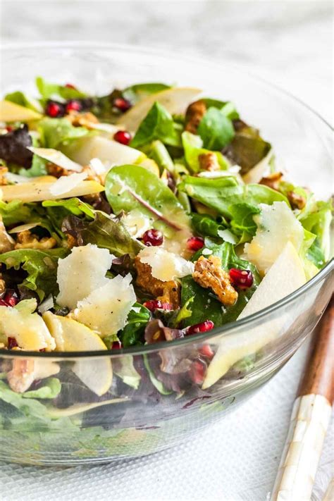pomegranate-pear-salad-with-walnuts-cheese-plated image