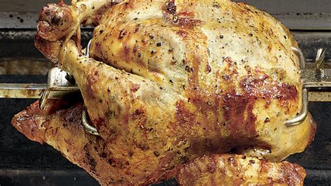 spit-roasted-chicken-with-tarragon-butter-finecooking image