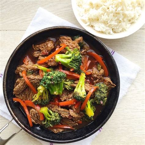 beef-and-broccoli-with-red-peppers-delish image