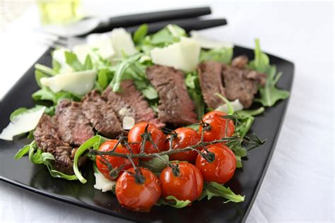steak-tagliata-with-roasted-vine-tomatoes image