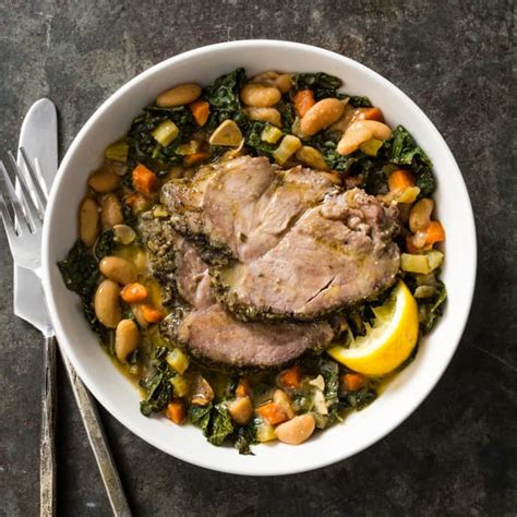 slow-cooker-herbed-pork-with-white-beans-and-kale image
