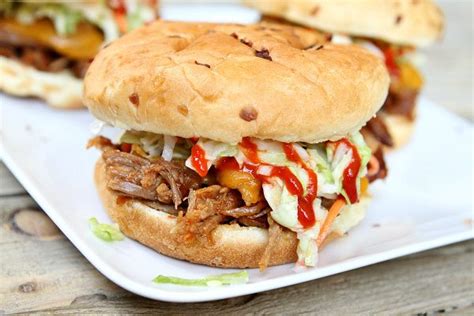 slow-cooker-sweet-and-spicy-pulled-pork-sandwiches image