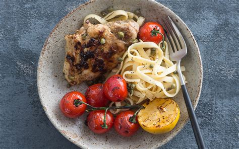 grilled-chicken-thighs-with-charred-tomatoes-lemons image
