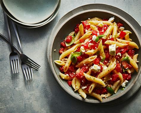 pasta-with-basil-tomatoes-and-feta-recipe-myrecipes image