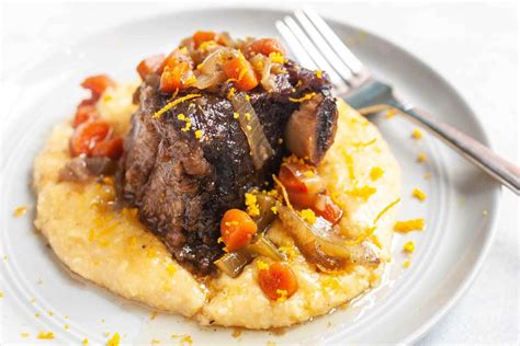 slow-cooker-bourbon-short-ribs-with-cheesy-grits image