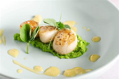 seared-scallops-with-pea-puree-butter image