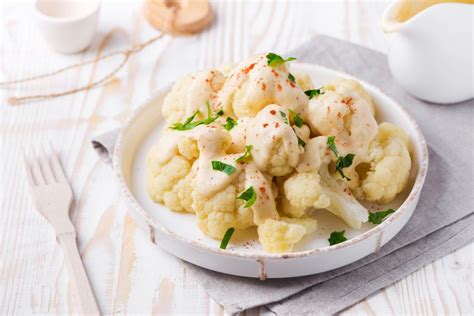 easy-cauliflower-with-cheese-sauce-recipe-the-spruce image