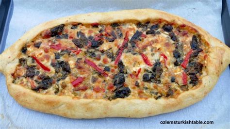 turkish-flat-breads-with-spinach-feta-and-peppers-peynirli-pide image