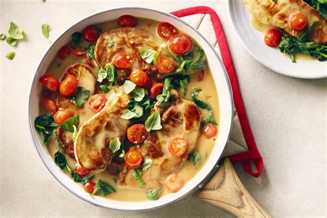 saucy-pork-chops-with-spinach-and-tomatoes-cook image