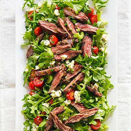 steak-salad-with-tomato-and-blue-cheese image