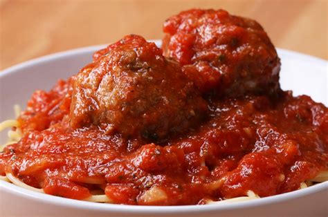 easy-slow-cooker-mozzarella-stuffed-meatballs-and-sauce image
