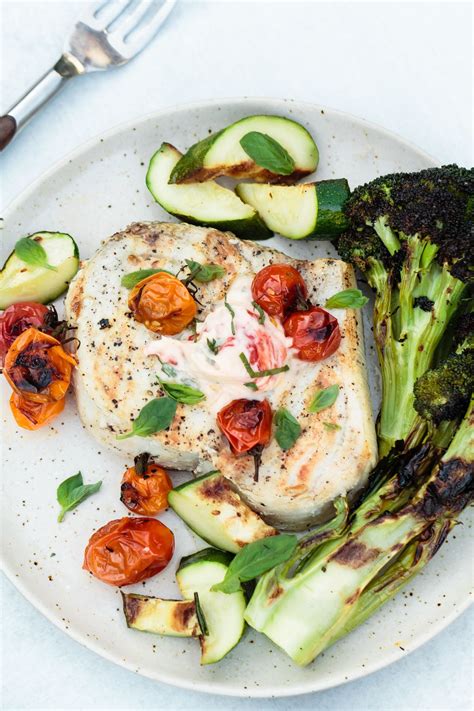 grilled-swordfish-with-charred-tomato-basil-butter image