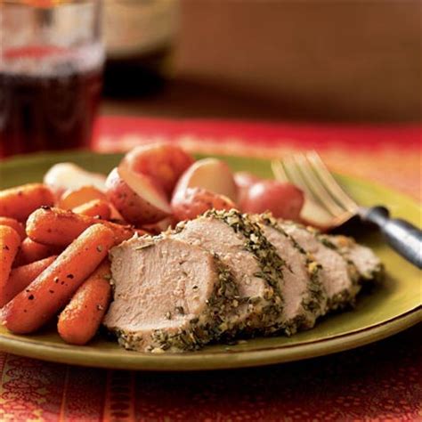 pork-tenderloin-studded-with-rosemary-garlic image