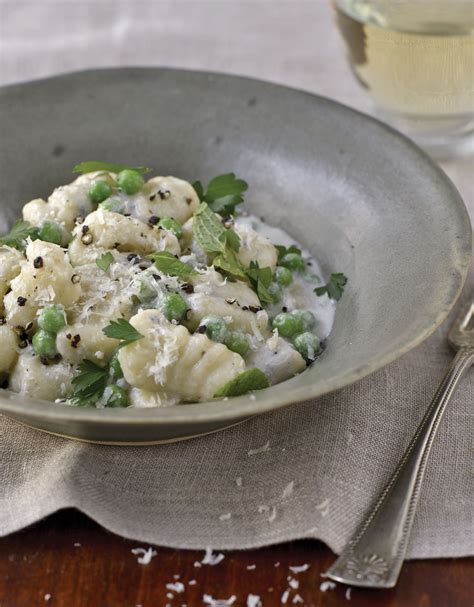 potato-gnocchi-with-sweet-peas-and-gorgonzola-sauce image