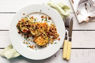 grilled-celeriac-steaks-with-pine-nut-and-currant-relish image