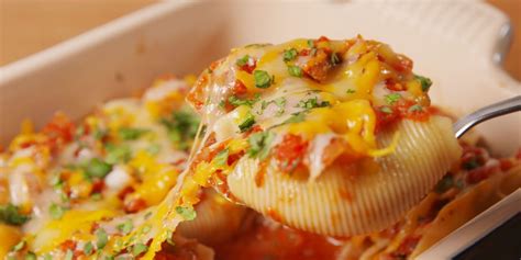 how-to-make-cheesy-taco-stuffed-shells-delish image