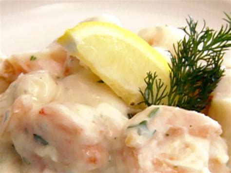 shrimp-and-scallops-in-garlic-cream-sauce-cooking image
