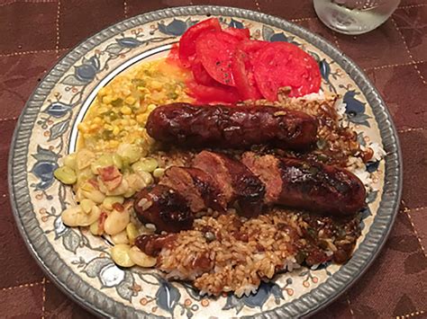 smothered-cajun-fresh-sausage-with-rice-gravy image