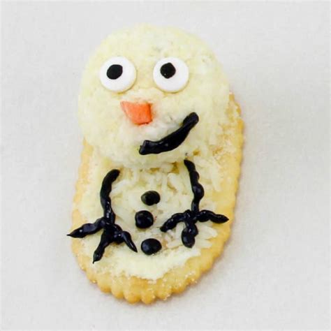 melting-snowman-cheese-ball-recipe-on-my-kids-plate image