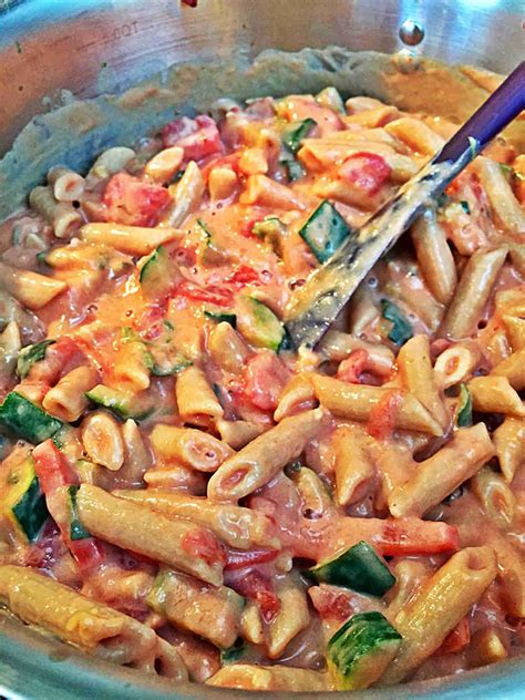 creamy-tofu-pasta-sauce-with-garlic-zucchini-tomato image