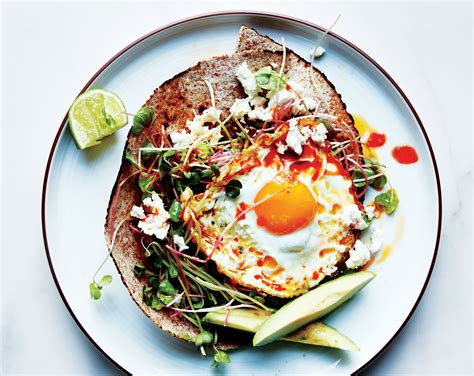 chile-and-olive-oil-fried-egg-with-avocado-and-sprouts image
