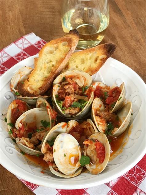 clams-with-spicy-sausage-in-garlicky-tomato-broth image