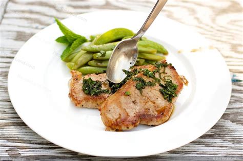 pork-chops-and-sugar-snap-peas-with-mint-julep-glaze image