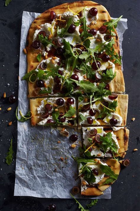 tiffani-thiessens-pizza-with-ricotta-arugula-and-grapes image