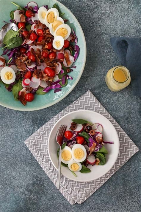spinach-salad-with-bacon-and-hard-boiled-eggs-tasty image