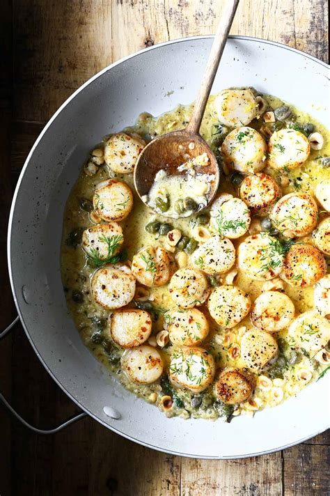 lemon-garlic-scallops-with-polenta-serving-dumplings image