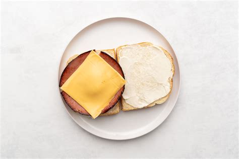 fried-bologna-and-cheese-sandwich-recipe-the-spruce image