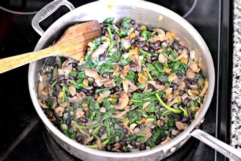 spinach-mushroom-and-black-bean-enchiladas image