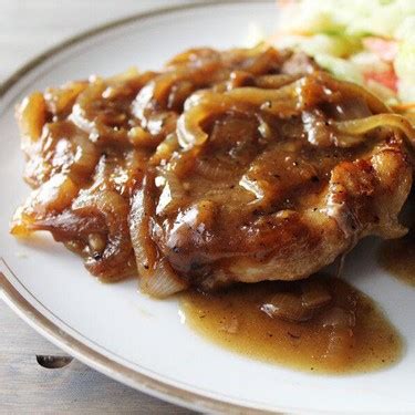 smothered-onion-pork-chops-recipe-sidechef image