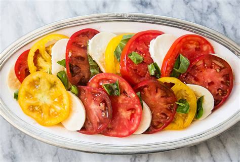 caprese-salad-with-tomatoes-basil-and-mozzarella image