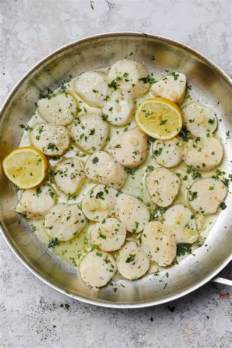 broiled-scallops-with-garlic-butter-sauce-well image