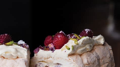 meringue-roulade-with-rose-petals-and-fresh-raspberries image