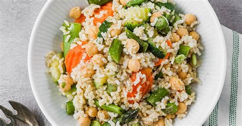 easy-brown-rice-pilaf-with-spring-vegetables-eatingwell image
