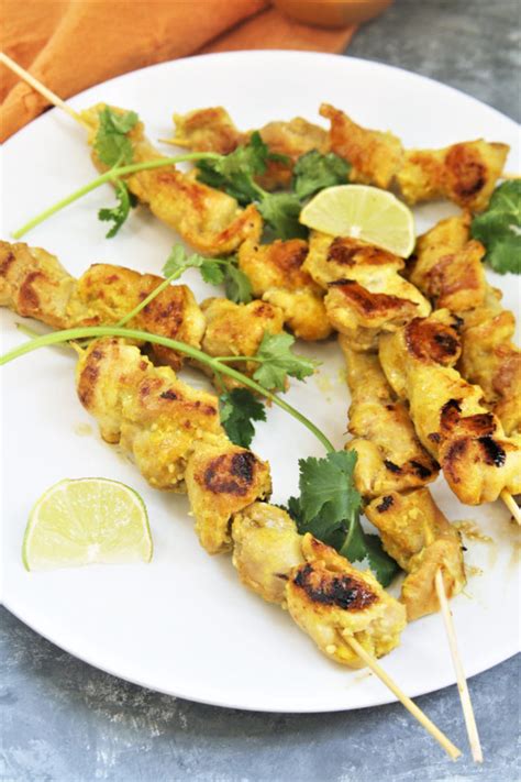 chicken-satay-skewers-with-peanut-sauce-the-tasty-bite image