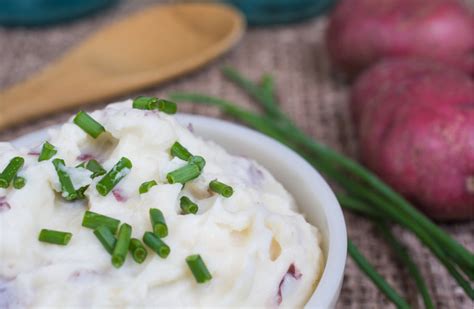 mashed-potatoes-with-chives-and-dijon-the-daily-meal image