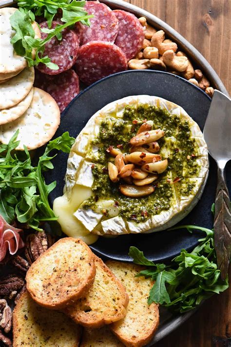 savory-baked-brie-with-pesto-garlic-foxes-love image