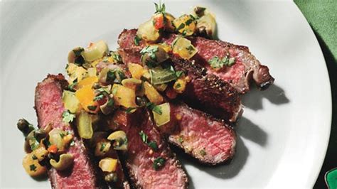 seared-rib-eye-steak-with-tomato-caper-relish-bon image