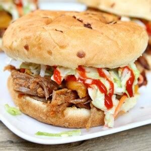 slow-cooker-sweet-and-spicy-pulled-pork-sandwiches image