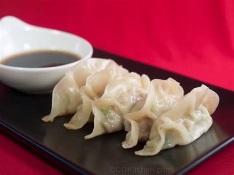 chinese-pork-dumplings-with-soy-ginger-dipping-sauce image
