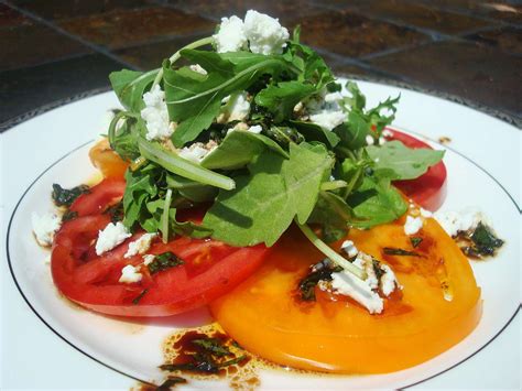 heirloom-tomato-salad-with-goat-cheese-and-arugula image