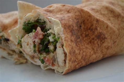 chicken-pita-rolls-with-hummus-tabbouleh image