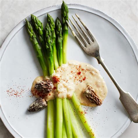 green-asparagus-with-morel-hollandaise-sauce image