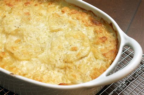 scalloped-potatoes-with-white-sauce-recipe-the-spruce image